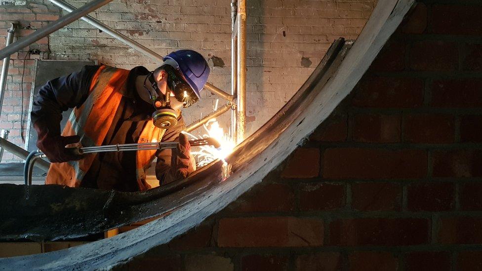 Worker welding at Colston Hall