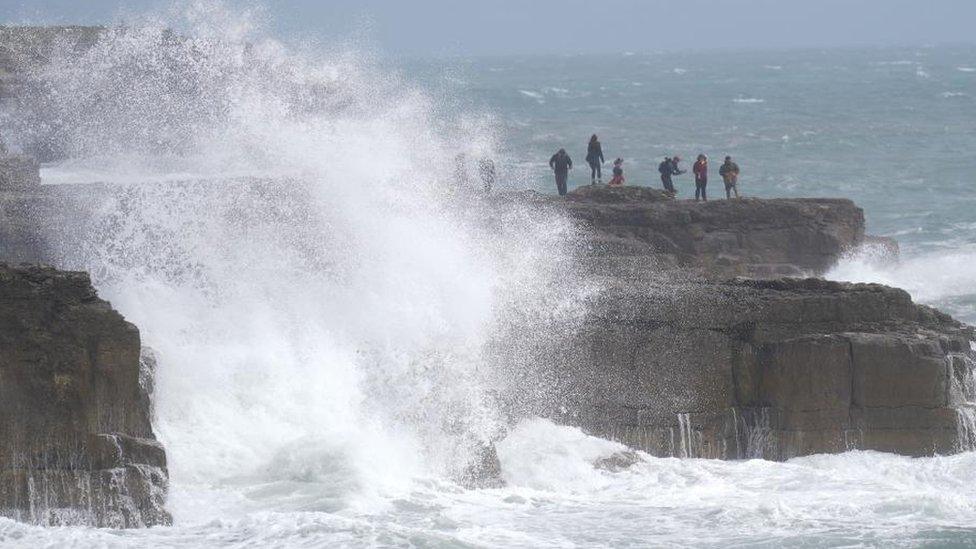 Waves crashing against the shore in Portland, Dorset