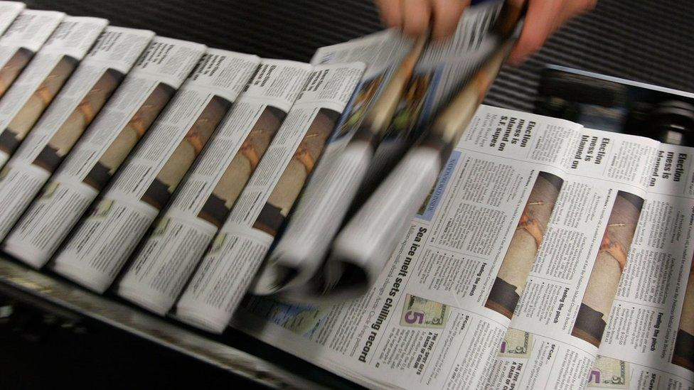 newspapers on a rack from 2007