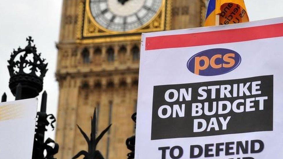 Civil servants from the Public and Commercial Services (PCS) union stand outside the House of Commons in 2010