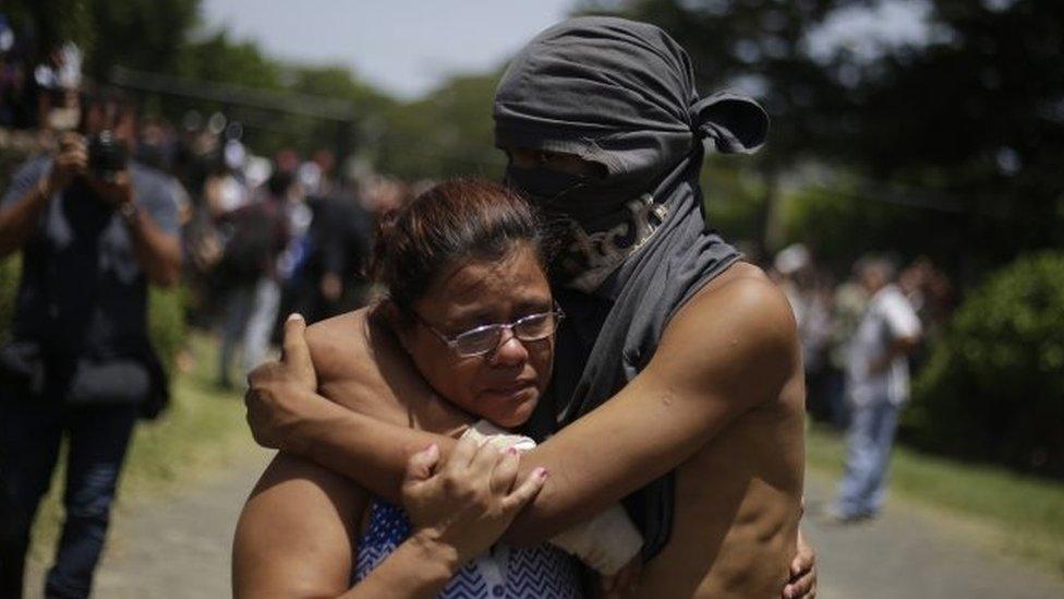 A student hugs a relative after having taken shelter in the parish Divina Misericordia, in Managua, Nicaragua, 14 July 2018