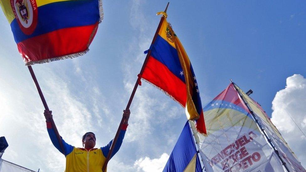 Nicolas Maduro waved the flags of Colombia and Venezuela during a rally in Caracas