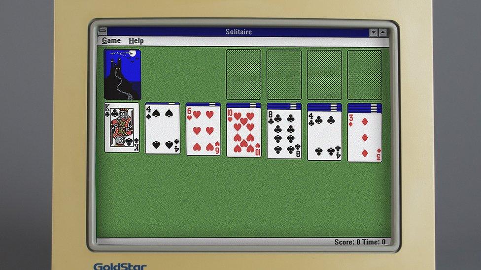 Old computer monitor showing Microsoft Windows Solitaire