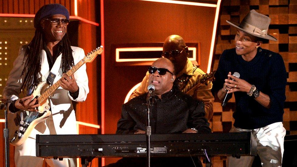 Nile Rodgers performing with Stevie Wonder and Pharrell Williams at the 2014 Grammy Awards