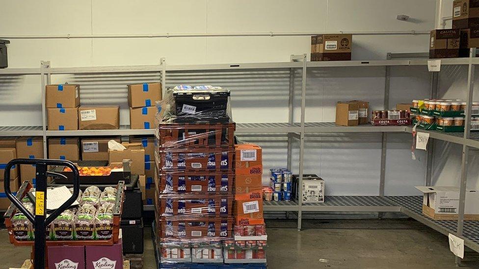 barely stocked food bank shelves