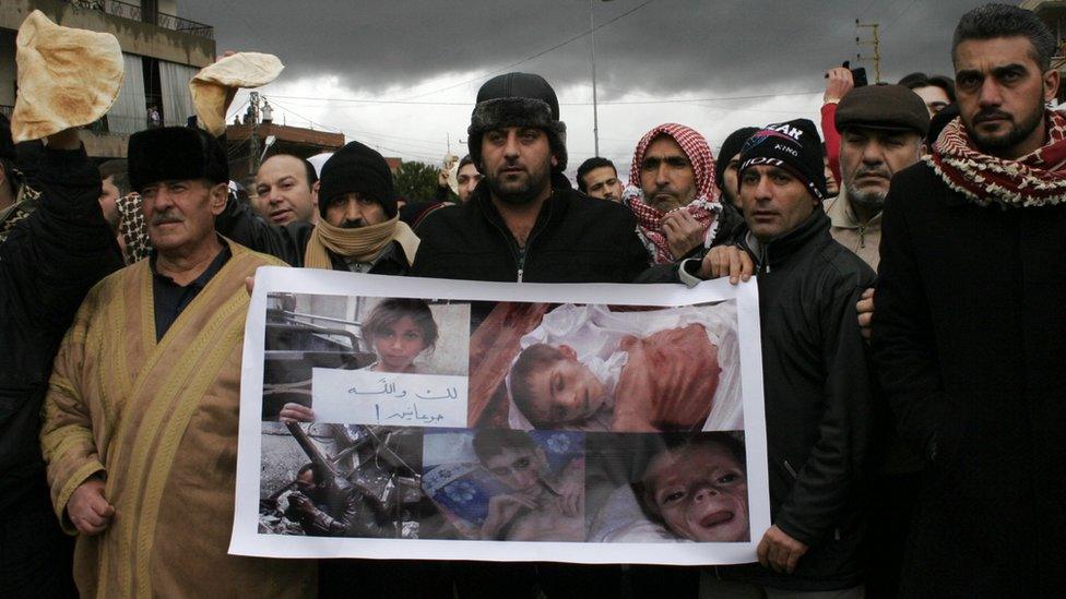 Lebanese Sunni Muslims gather at the Masnaa crossing on the Lebanon-Syria border blocking the road leading to Damascus in protest of the ongoing besiege imposed on the Syrian town of Madaya, on 8 January