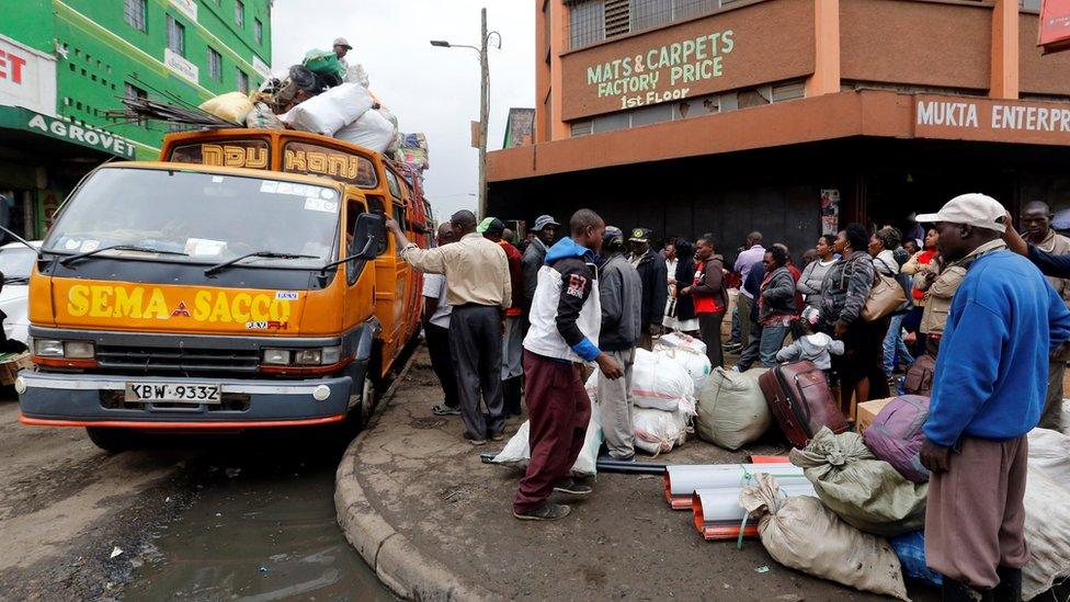 Passengers wait for buses in Nairobi to travel to rural homes ahead of next week's vote 3 August 2017