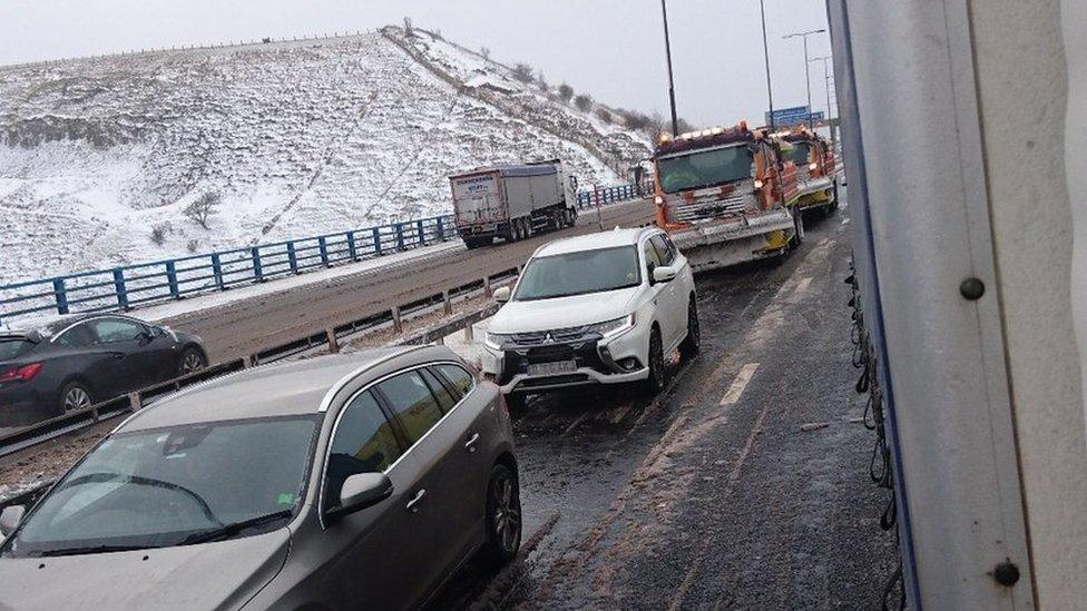 Gritters in traffic jam