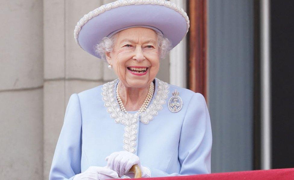 Britain's Queen Elizabeth II stands on the Balcony of Buckingham Palace as the troops march past during the Queen's Birthday Parade, the Trooping the Colour