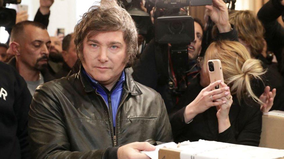 Argentine congressman and presidential pre-candidate for La Libertad Avanza Alliance, Javier Milei, casts his vote during primary elections at a polling station in Buenos Aires on August 13, 2023.