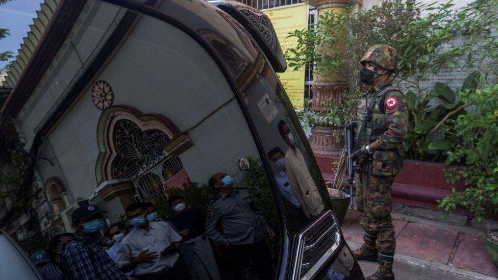 A soldier standing guard outside a temple in Yangon in the aftermath of the coup, 2 February 2021