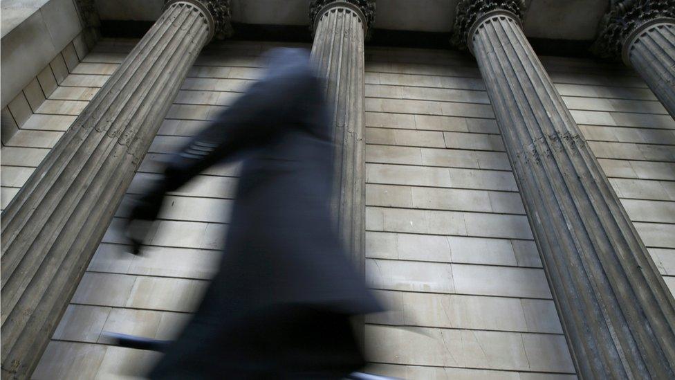 Man walking through City of London