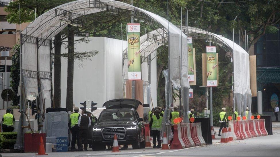 Police inspect vehicles at a checkpoint near Singapore's St Regis Hotel ahead of Mr Kim's expected arrival there