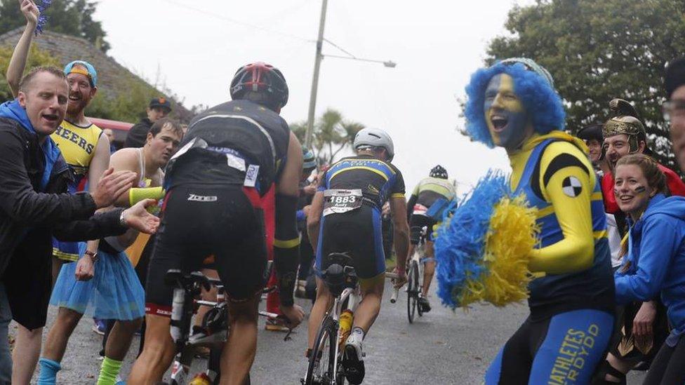 Fans cheering on athletes at Ironman Wales