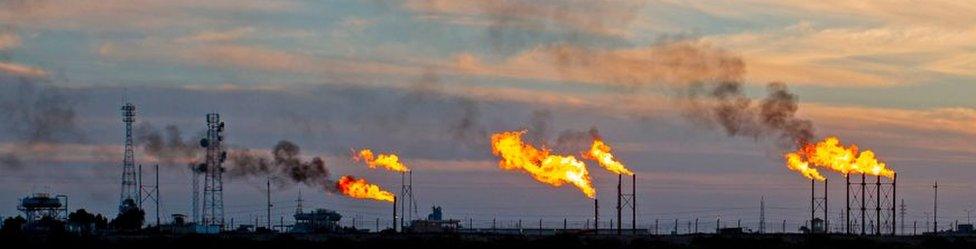 Gas flaring at an oilfield near Basra in Iraq