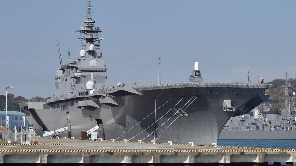 This picture taken on 6 December 2016 shows the Japan Maritime Self Defense Forces helicopter carrier Izumo at a berth in its Yokosuka Base in Kanagawa prefecture