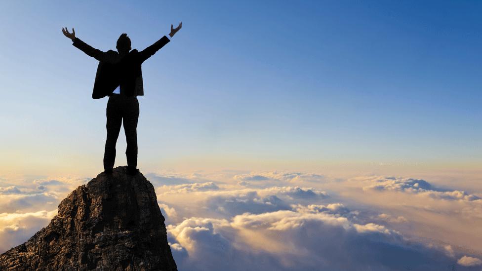 Person at the top of a mountain