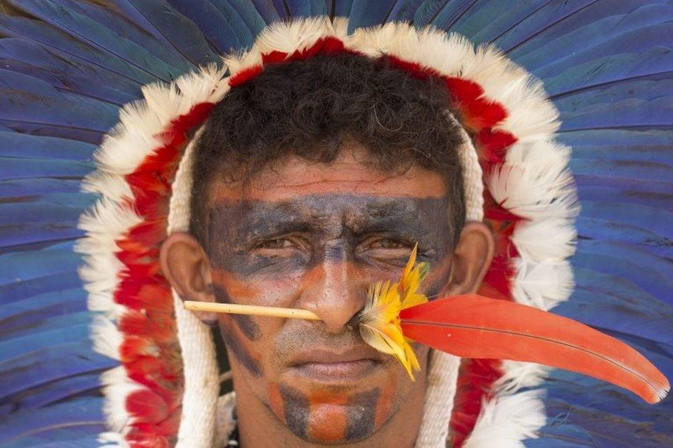 A Brazilian indigenous person stand in a protest next to Explanada dos Ministerios in Brasilia, Brazil, on 25 April 2017