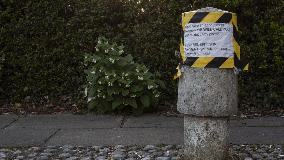 A sign on a bollard