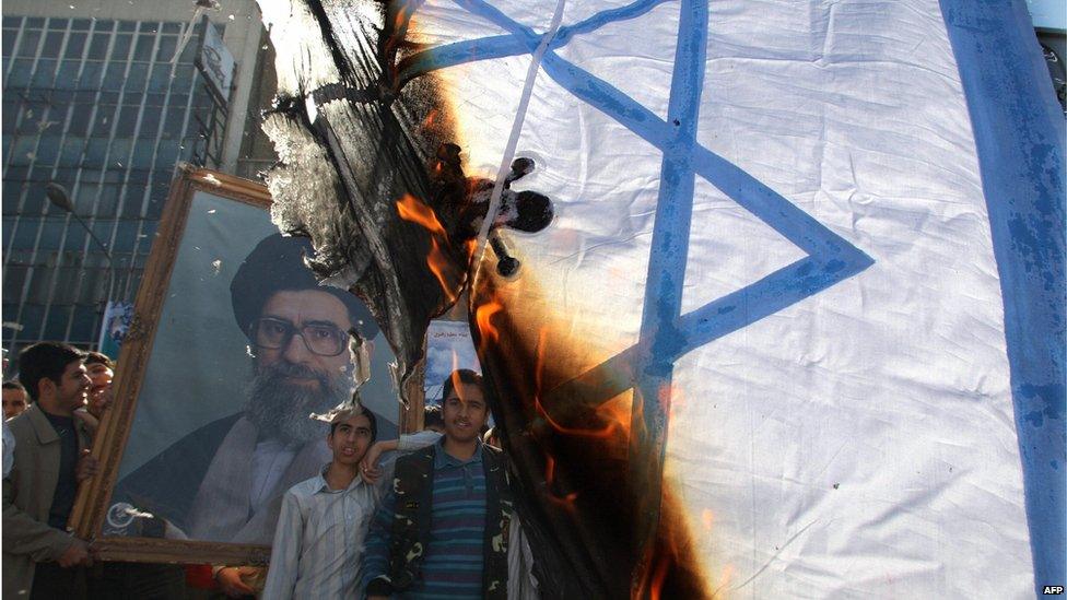 Iranians burn Israeli flag in Tehran (file photo)