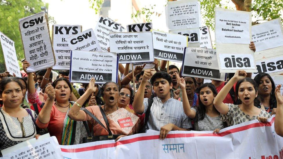 Indian activists hold placards that read in Hindi "Indian Government take stern action against the rapists" as they protest against the alleged rapes Uttar Pradesh and Jammu and Kashmir, in New Delhi, India, 12 April 2018.