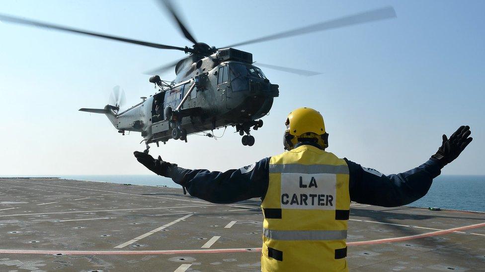 Sea King helicopter landing on HMS Bulwark