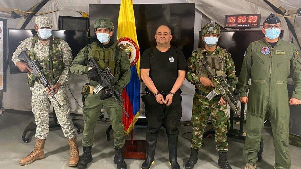 Dairo Antonio Usuga David (C), alias "Otoniel", after his capture in Carepa, Colombia, 23 October 2021.