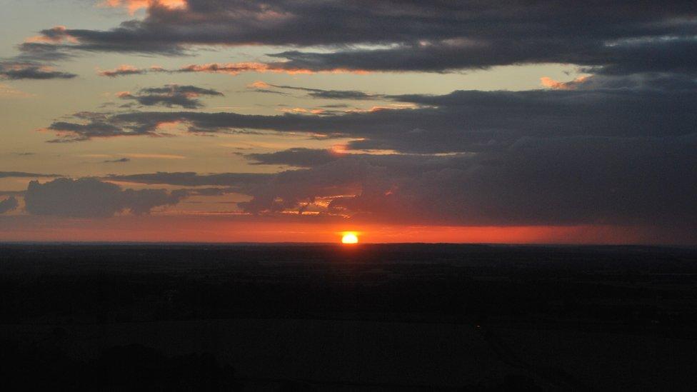 The sun setting over Oxford, from the Chilterns.