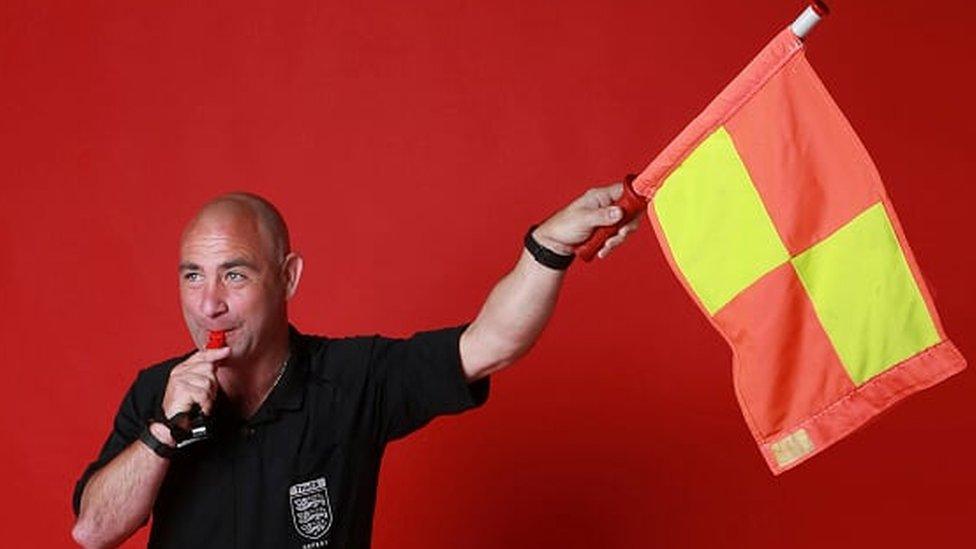 Shaun Tobin holding flag