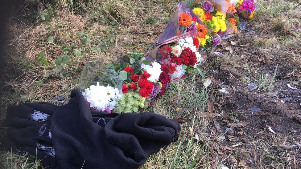 Floral tributes to those who have died in Friday's crash