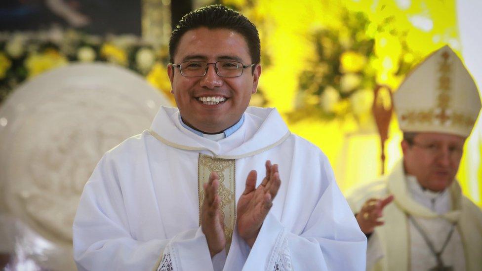 Miguel Pantaleon smiling inside a church