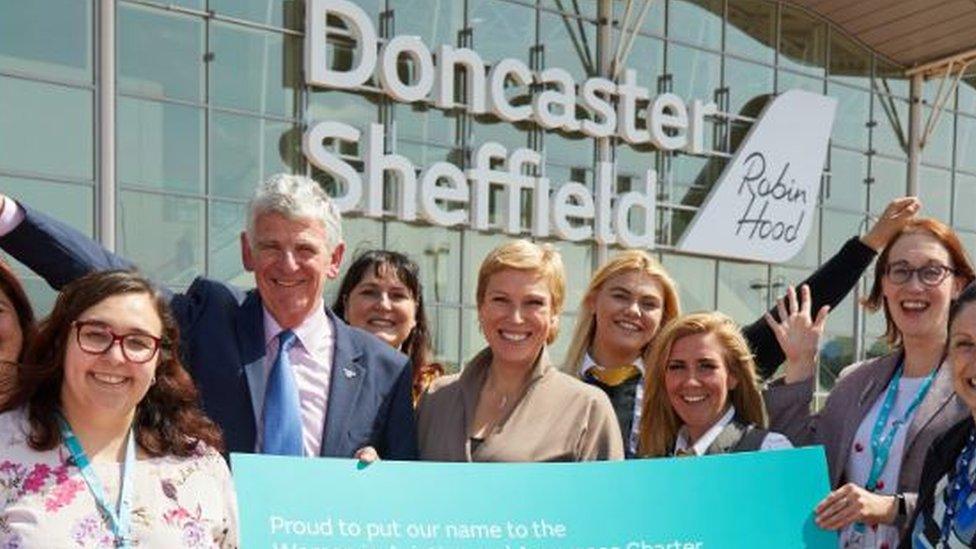 Robert Hough of Doncaster Sheffield Airport with Aviation Minister Baroness Charlotte Vere, and DSA's female employees