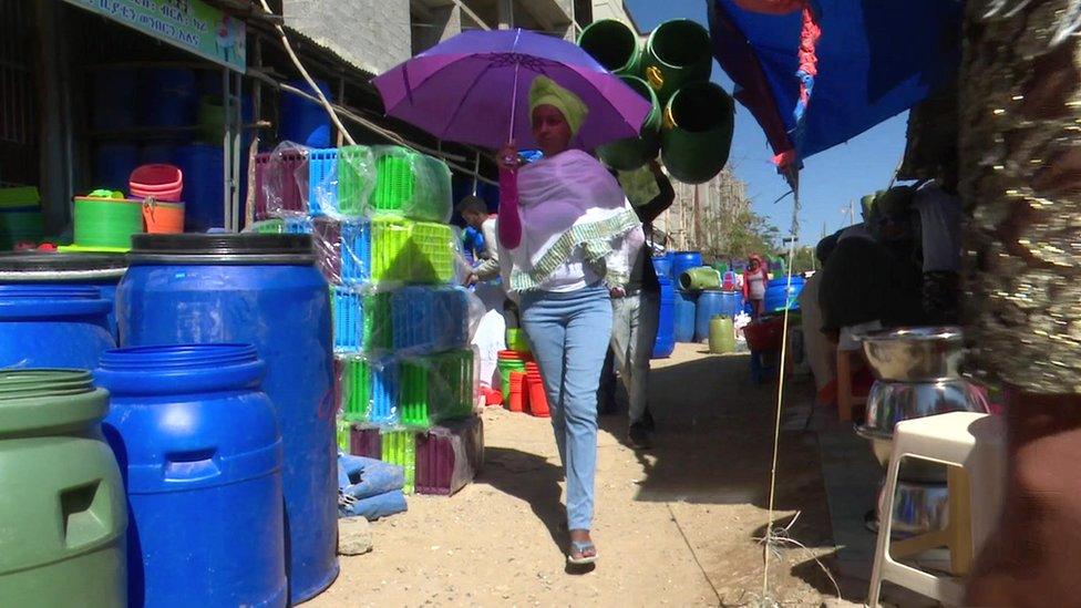 Woman walking through the market