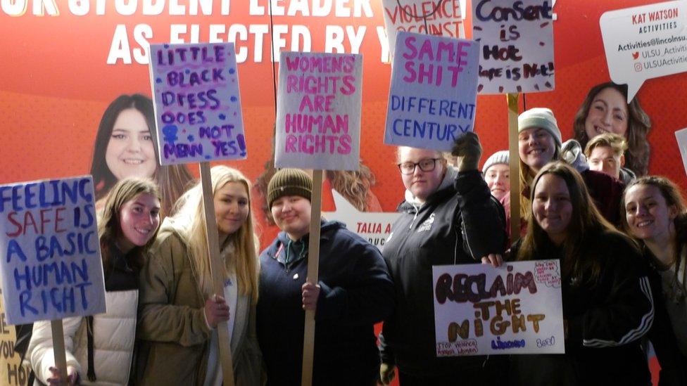 People holding placards