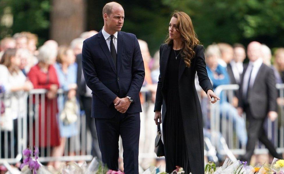 The Prince and Princess of Wales view floral tributes left by members of the public at the gates of Sandringham House in Norfolk, following the death of Queen Elizabeth II