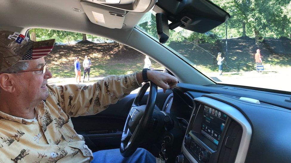 Shockey sits in the driver's seat of a truck