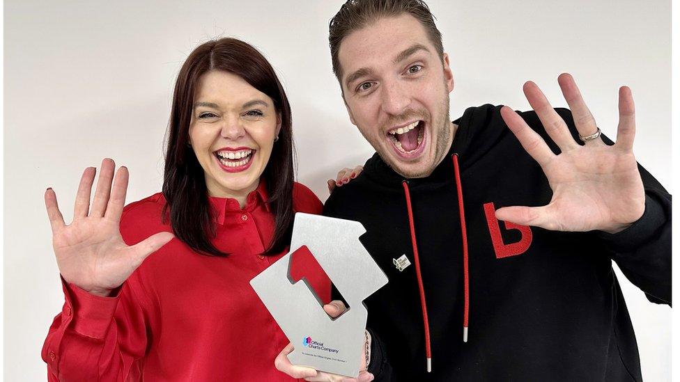 LadBaby celebrate their fifth Official Christmas Number 1 single with Food Aid as they pose with their Official Charts Company Number 1 Award