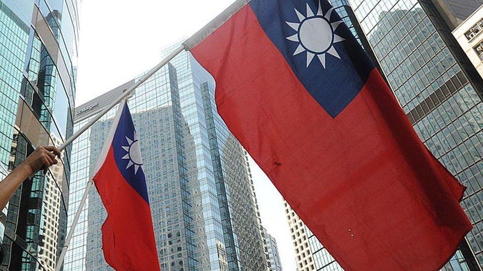 Protestors wave Taiwanese flags in Hong Kong on 17 September 2010.