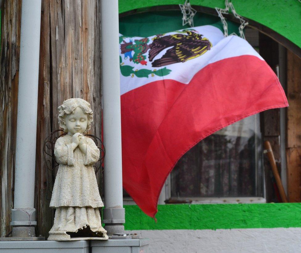 Mexican flag in front of house