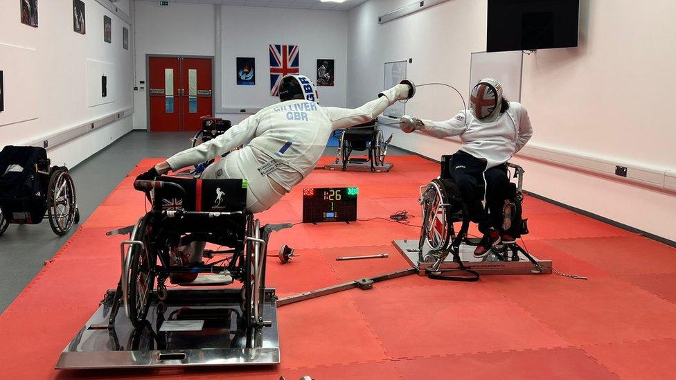 Two wheelchair fencers