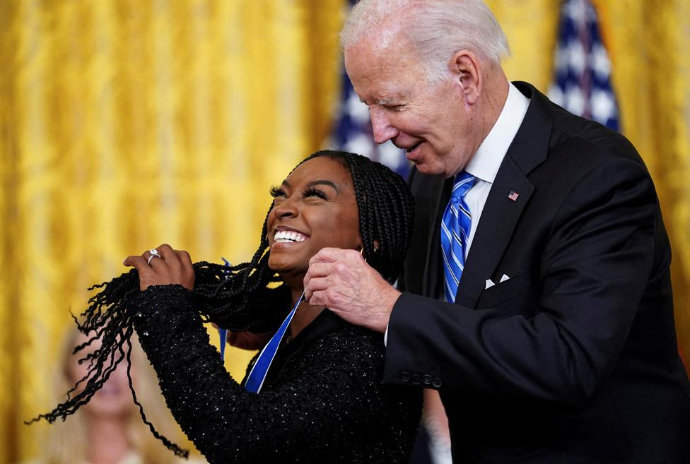 US President Joe Biden awards the Presidential Medal of Freedom to Olympic gymnast Simone Biles during a ceremony in the East Room at the White House, Washington DC, 7 July 2022