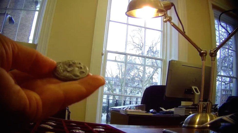 Undercover recording from BBC News Arabic showing an Alexander decadrachm coin at the office of Roma Numismatics in London