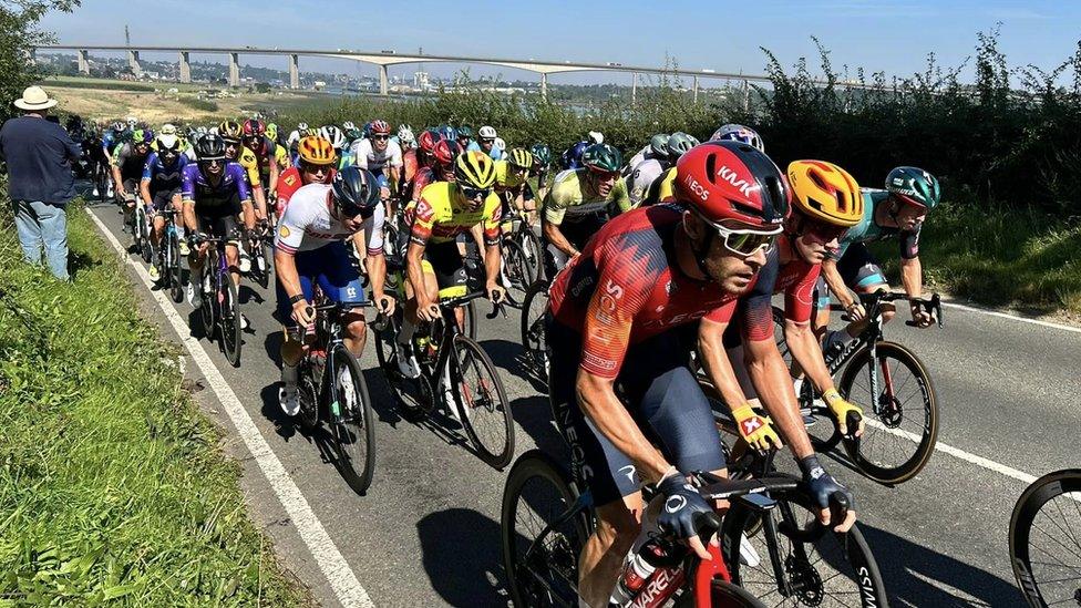 Tour of Britain cyclists with Orwell Bridge in the background