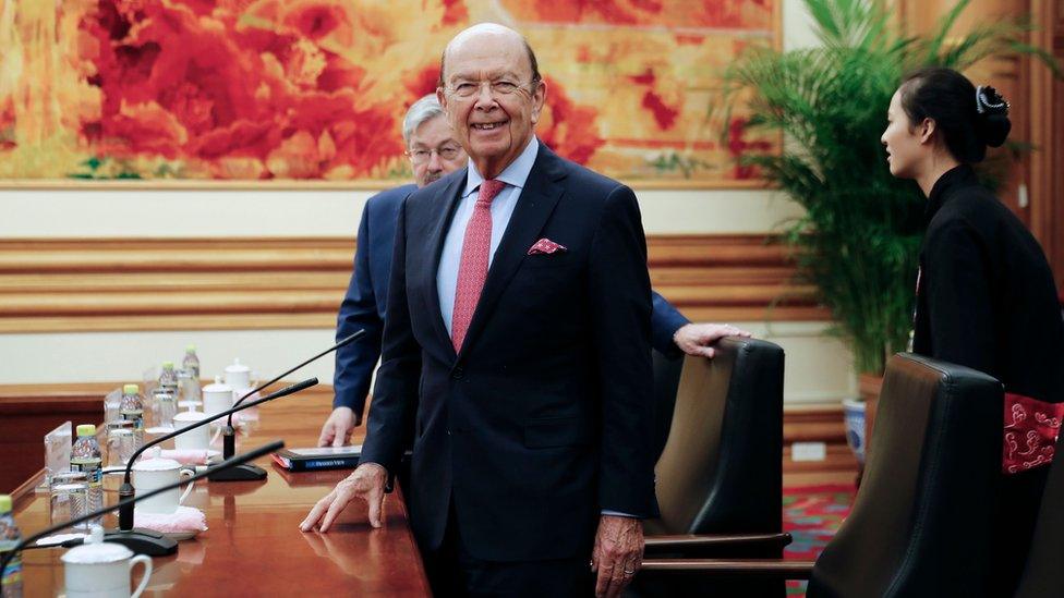 US Commerce Secretary Wilbur Ross (C) is accompanied by US Ambassador to China Terry Branstad as they arrive for a bilateral meeting with Chinese Vice Premier Wang Yang at the Zhongnanhai Leadership Compound in Beijing on September 25, 2017