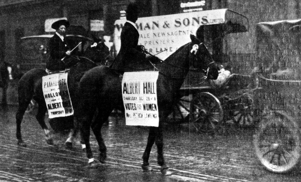 Women's equestrian parade in the streets of London, calling for a suffragettes' meeting at the Albert Hall