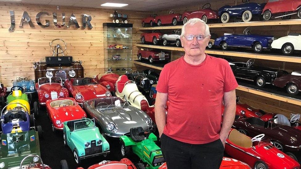 David Morrow with his collection of vintage pedal cars