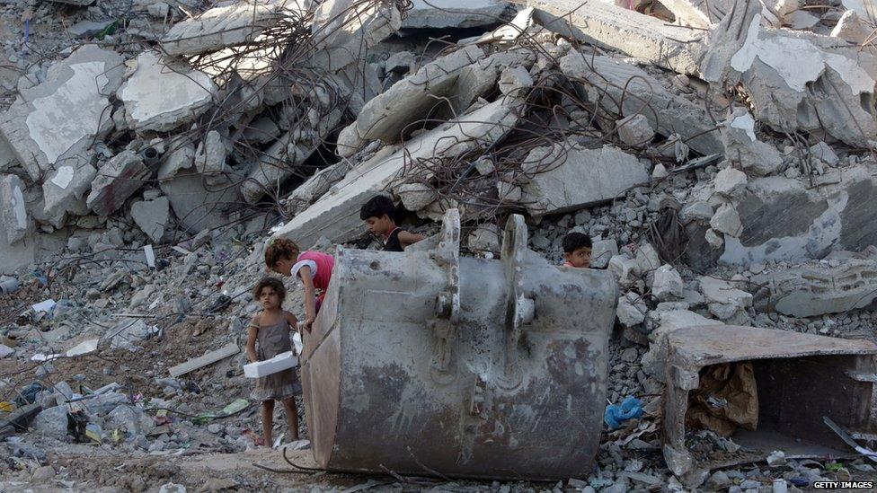 Children play in rubble, Gaza City, June 2015