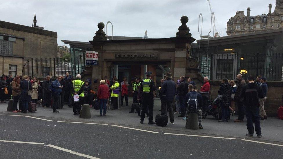 Passengers outside station