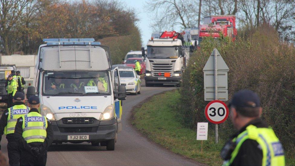 Lorries and police convoy