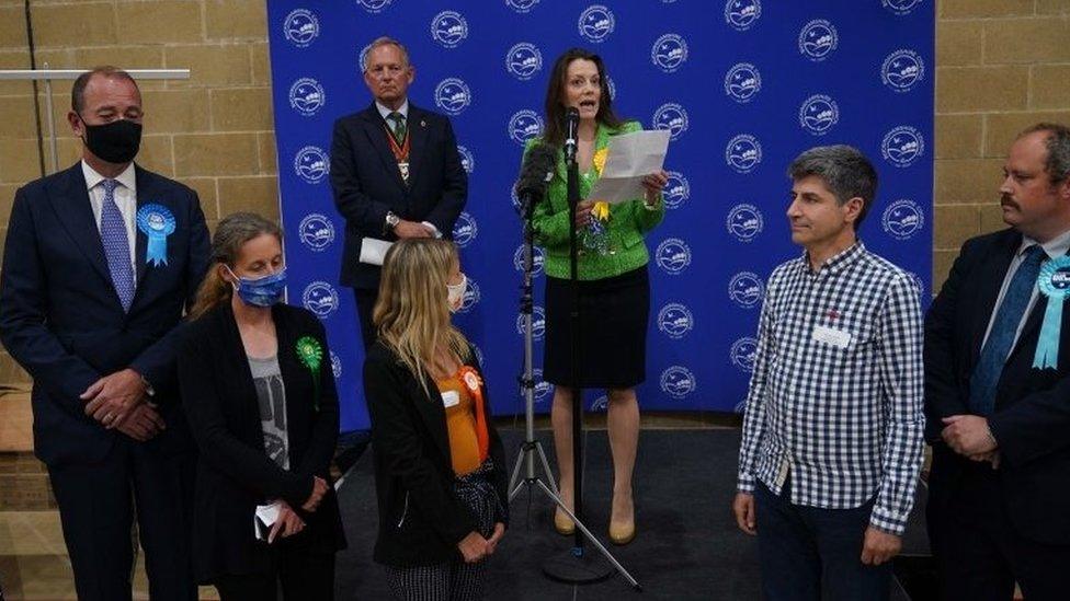 Lib Dem Sarah Green makes a speech after being declared winner in the Chesham and Amersham by-election, where she defeated Conservative candidate Peter Fleet (left)